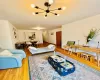 Living room with wood finished floors and a chandelier Living room with wood finished floors and a chandelier