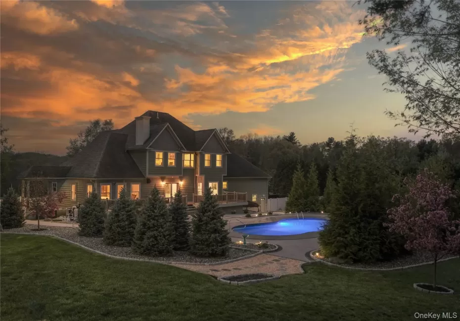 A backyard daydream, where a pristine pool and playful pops of luxury invite you to dive right in. A backyard daydream, where a pristine pool and playful pops of luxury invite you to dive right in.