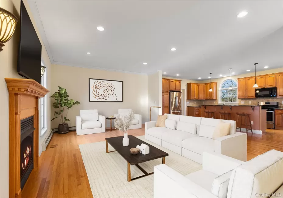 Virtually staged. Large open space living room, gas fireplace open to the kitchen and more Virtually staged. Large open space living room, gas fireplace open to the kitchen and more