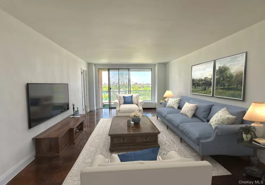 Living area featuring baseboards and wood finished floors Living area featuring baseboards and wood finished floors