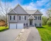 Modern gray siding exterior with black window shutters Modern gray siding exterior with black window shutters