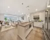 Kitchen with visible vents, appliances with stainless steel finishes, modern cabinets, open shelves, and a sink Kitchen with visible vents, appliances with stainless steel finishes, modern cabinets, open shelves, and a sink
