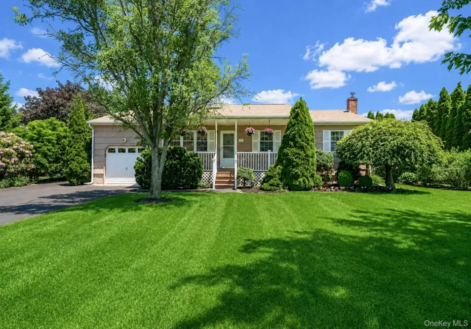 Ranch-style residence featuring a single-car garage, newly paved large driveway, covered front porch Ranch-style residence featuring a single-car garage, newly paved large driveway, covered front porch