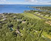 Aerial overview of property's location with a nearby body of water and property boundaries highlighted Aerial overview of property's location with a nearby body of water and property boundaries highlighted