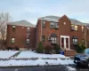 Traditional-style house featuring brick siding Traditional-style house featuring brick siding