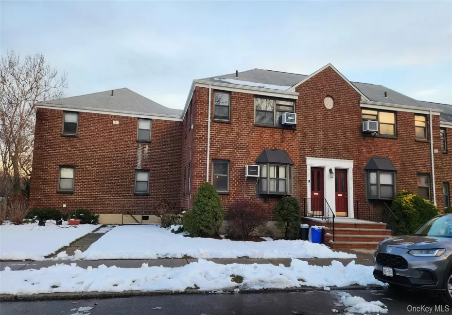 Traditional-style house featuring brick siding Traditional-style house featuring brick siding
