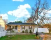 Single story home featuring driveway. Single story home featuring driveway.