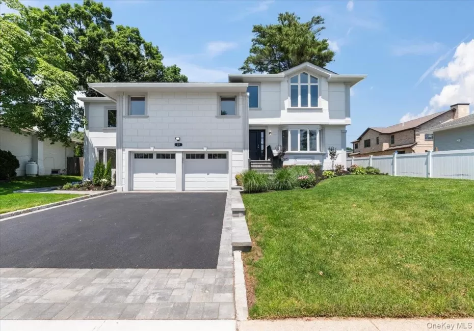 View of front of home with a garage and driveway View of front of home with a garage and driveway