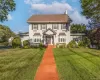 Classic center hall colonial on a large lot with a deep front lawn, herringbone brick walkway and timeless 2 story elegance Classic center hall colonial on a large lot with a deep front lawn, herringbone brick walkway and timeless 2 story elegance