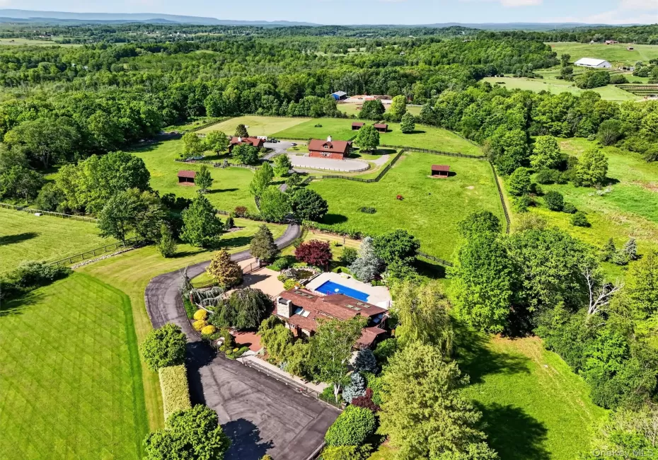 Set in a bucolic area of fine homes, the house has lovely views of the hills beyond the farm Set in a bucolic area of fine homes, the house has lovely views of the hills beyond the farm