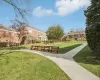 View of property's community featuring a lawn View of property's community featuring a lawn