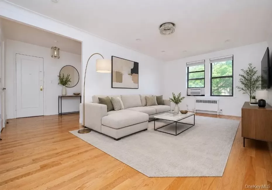 Photo is visually staged. Large living room has refinished hardwood floors and is approx 21'-4" x 12'-11" Photo is visually staged. Large living room has refinished hardwood floors and is approx 21'-4" x 12'-11"