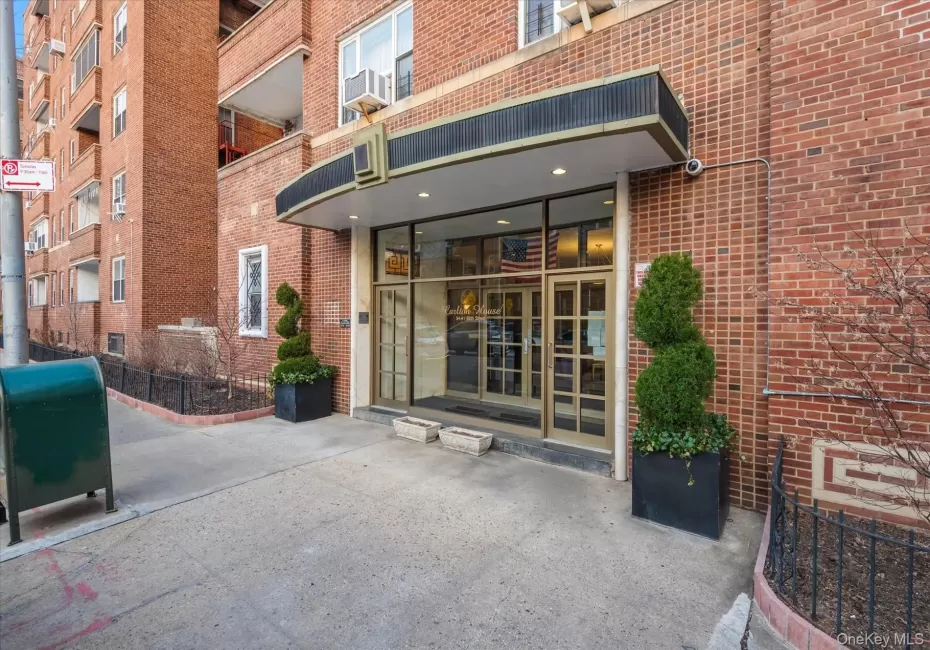 Entrance to property featuring french doors and brick siding Entrance to property featuring french doors and brick siding