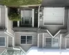 2 story Townhome exterior featuring vinyl siding in a neutral tone 2 story Townhome exterior featuring vinyl siding in a neutral tone