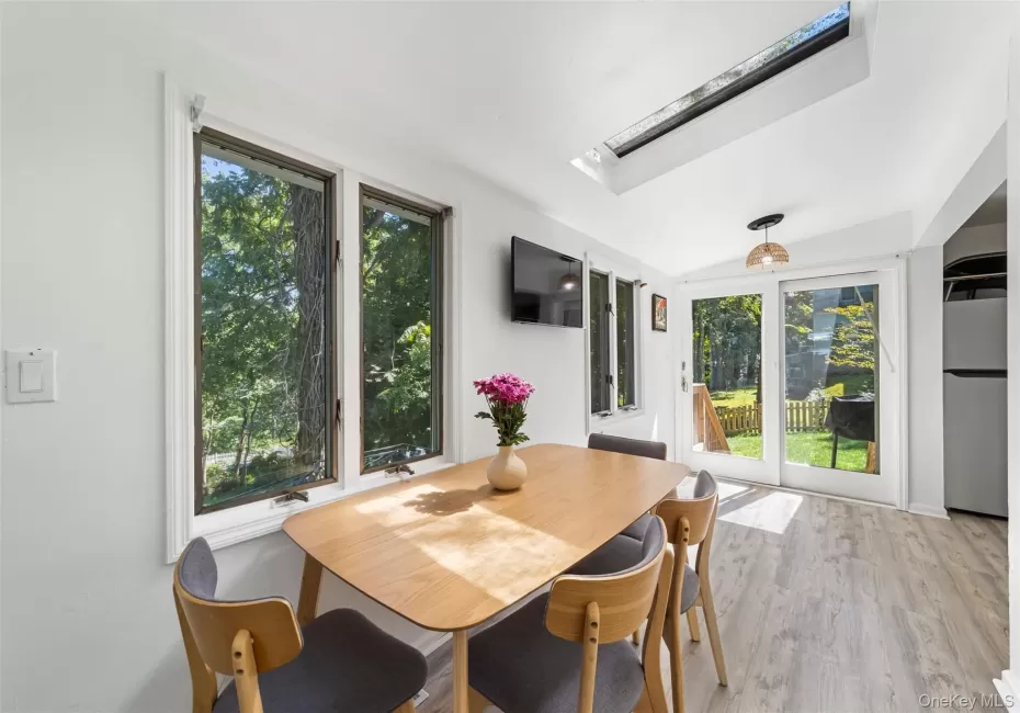 Dining area off the kitchen with sliding doors out to fenced in backyard Dining area off the kitchen with sliding doors out to fenced in backyard