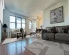 Living area featuring hardwood / wood-style flooring and ceiling fan Living area featuring hardwood / wood-style flooring and ceiling fan