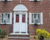 Entrance to property featuring brick siding and cooling unit Entrance to property featuring brick siding and cooling unit