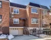Brick facade residence featuring a covered entry, decorative wrought iron railings and bay window. Brick facade residence featuring a covered entry, decorative wrought iron railings and bay window.