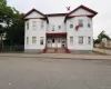 Two-story multi-unit property with light-colored horizontal siding Two-story multi-unit property with light-colored horizontal siding
