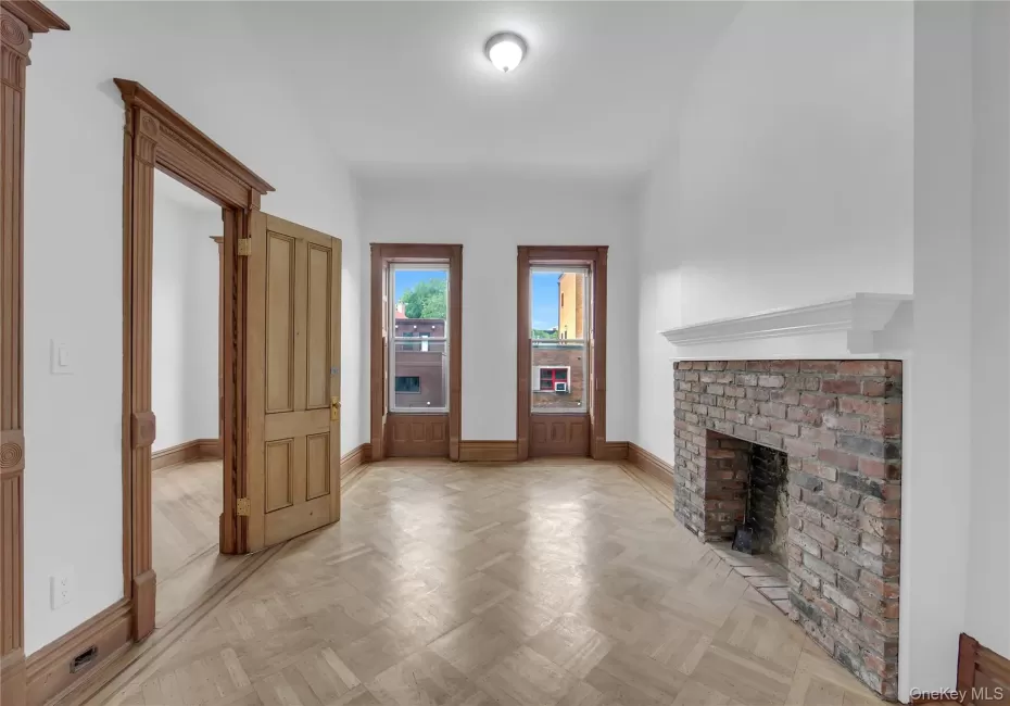 Living Room with 11' ceiings, hardwood floors and fireplace Living Room with 11' ceiings, hardwood floors and fireplace