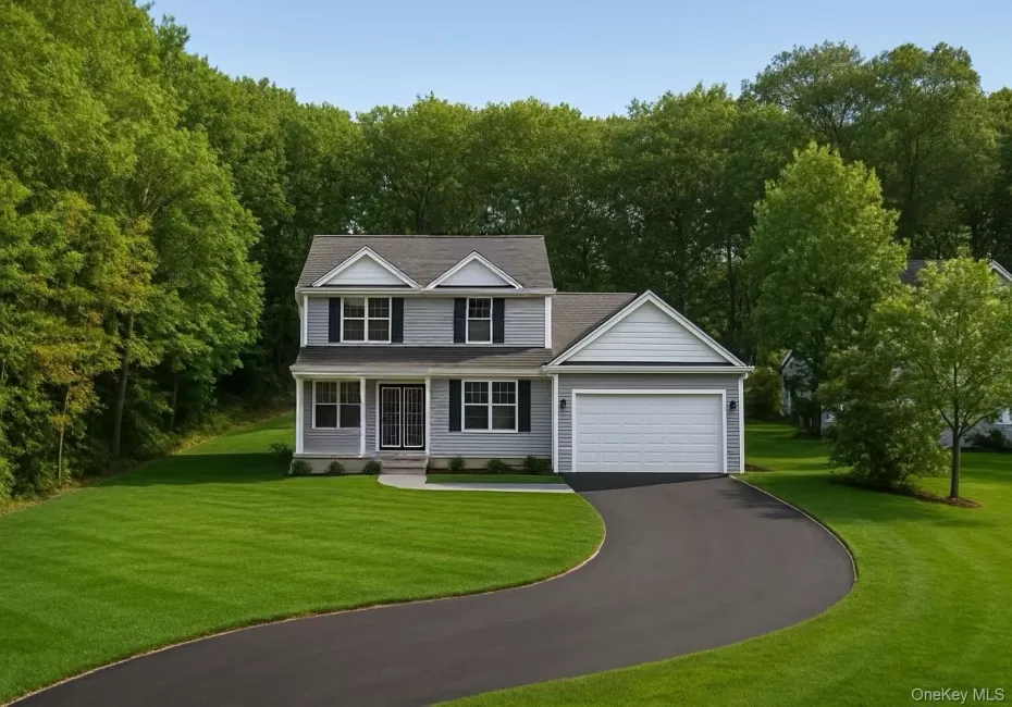 View of front facade featuring driveway, a front yard, a garage, and a porch View of front facade featuring driveway, a front yard, a garage, and a porch