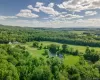Bird's eye view of a large body of water and a heavily wooded area Bird's eye view of a large body of water and a heavily wooded area