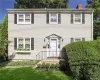 Colonial inspired home with a front lawn Colonial inspired home with a front lawn