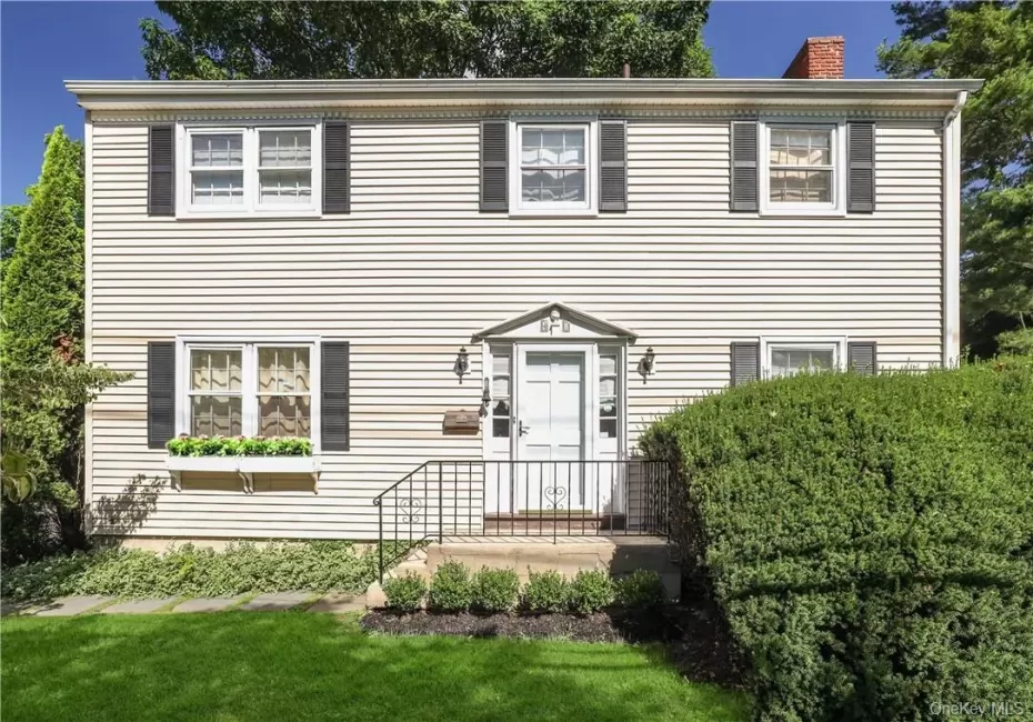 Colonial inspired home with a front lawn Colonial inspired home with a front lawn