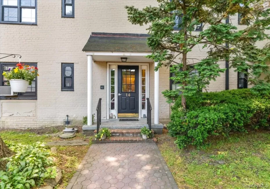 Interlaken Co-ops - a community of Garden Style apartments with brick exteriors. Covered entry and black front door to building #14 Manchester Interlaken Co-ops - a community of Garden Style apartments with brick exteriors. Covered entry and black front door to building #14 Manchester