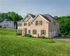 View of front of house featuring a garage and a front lawn View of front of house featuring a garage and a front lawn
