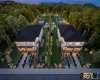 Modern twin residences featuring white exterior siding, dark roofs, and multiple windows Modern twin residences featuring white exterior siding, dark roofs, and multiple windows
