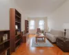 APT. 51 - View of south-facing 12'-0" x 20'-0" Sunken Living Room w/ original Art Deco details including herringbone parquet flooring, plaster archways & wrought iron railings. APT. 51 - View of south-facing 12'-0" x 20'-0" Sunken Living Room w/ original Art Deco details including herringbone parquet flooring, plaster archways & wrought iron railings.