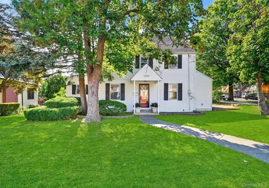 Colonial inspired home with a front yard Colonial inspired home with a front yard