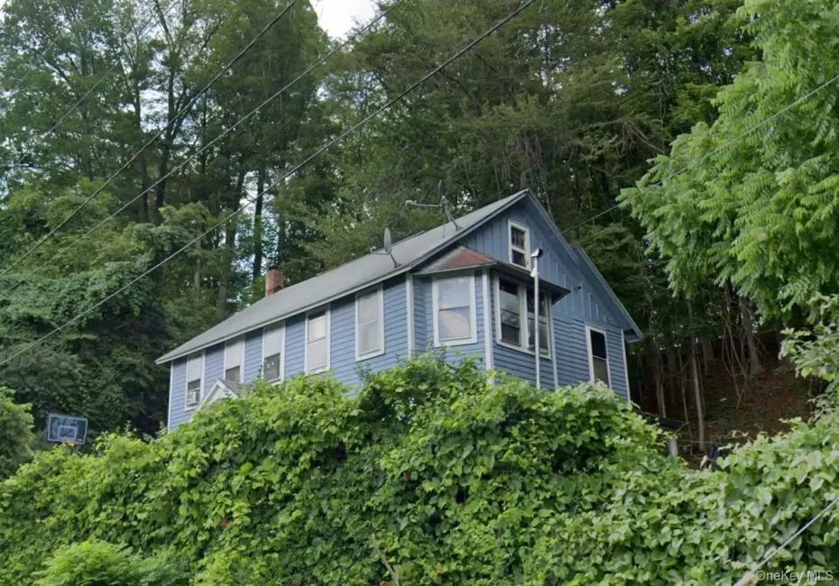 View of home's exterior with view of scattered trees and a chimney View of home's exterior with view of scattered trees and a chimney