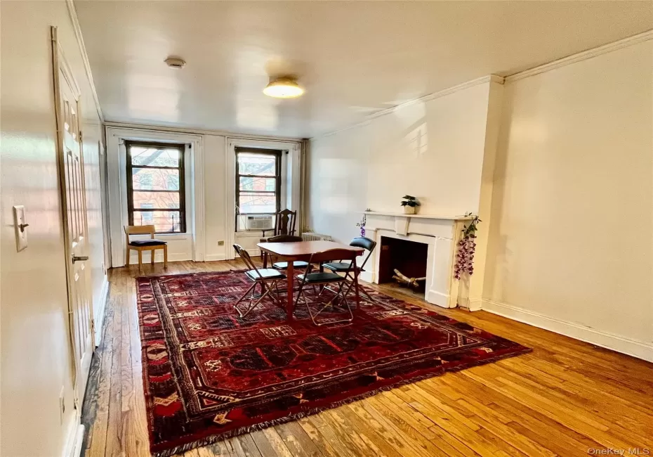 This lovely apartment has original hardwood floors throughout the living room and entry hallway. The space is beautifully lit by both the morning and afternoon sun. This lovely apartment has original hardwood floors throughout the living room and entry hallway. The space is beautifully lit by both the morning and afternoon sun.