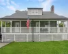 Front view. Notice the full front porch. Front view. Notice the full front porch.