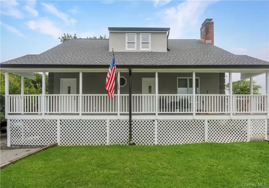 Front view. Notice the full front porch. Front view. Notice the full front porch.