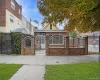 View of front of property with a fenced front yard, brick siding, and a gate View of front of property with a fenced front yard, brick siding, and a gate