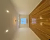Spare room featuring ornamental molding, hardwood / wood-style floors, radiator, and recessed lighting Spare room featuring ornamental molding, hardwood / wood-style floors, radiator, and recessed lighting