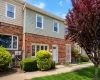 Brick and siding exterior with multiple windows Brick and siding exterior with multiple windows