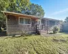Ranch-style home featuring a front lawn Ranch-style home featuring a front lawn