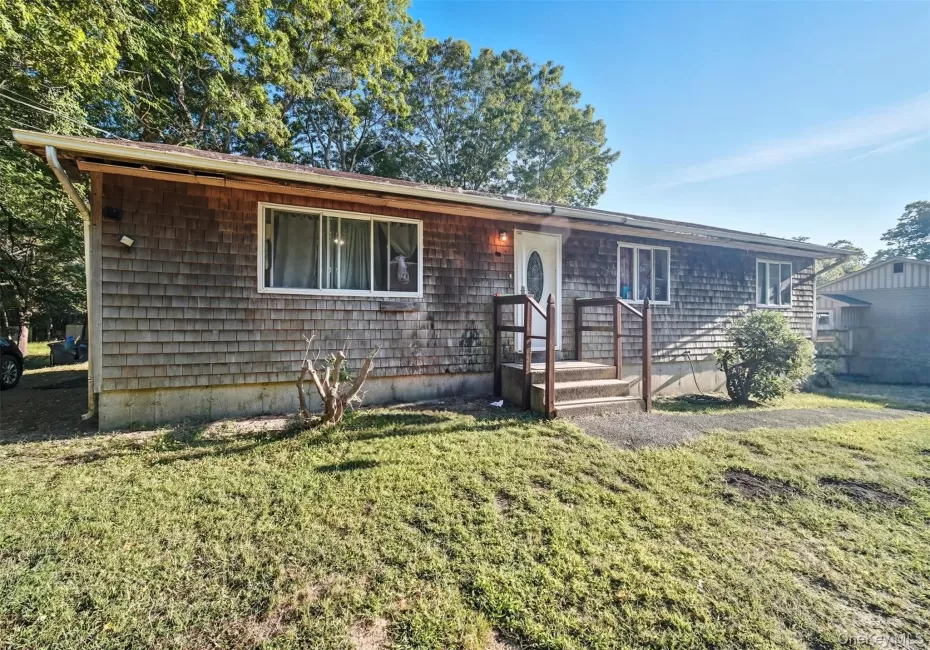 Ranch-style home featuring a front lawn Ranch-style home featuring a front lawn