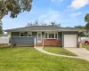 Ranch-style house with an attached garage, concrete driveway, and roof with shingles Ranch-style house with an attached garage, concrete driveway, and roof with shingles