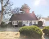 Cape cod home with a front yard Cape cod home with a front yard