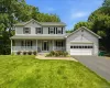 Two-story colonial with covered front porch and 2 car garage Two-story colonial with covered front porch and 2 car garage