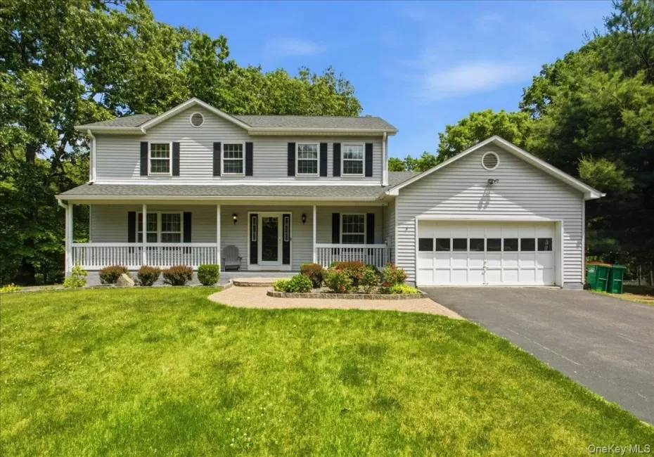 Two-story colonial with covered front porch and 2 car garage Two-story colonial with covered front porch and 2 car garage