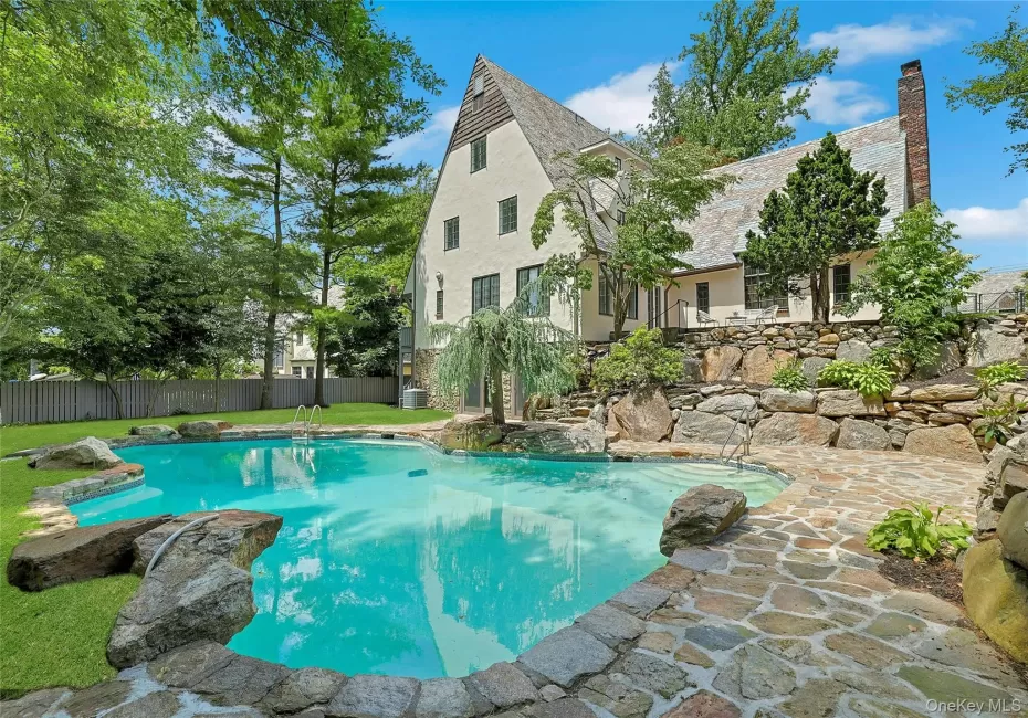 Resort-style living awaits at this spectacular, freshly renovated Tudor with an expansive, recently updated saltwater pool in the heart of the Edgemont. Resort-style living awaits at this spectacular, freshly renovated Tudor with an expansive, recently updated saltwater pool in the heart of the Edgemont.
