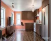 Open-concept living space w a full kitchen and a stainless steel side-by-side refrigerator, Virtually Staged Open-concept living space w a full kitchen and a stainless steel side-by-side refrigerator, Virtually Staged