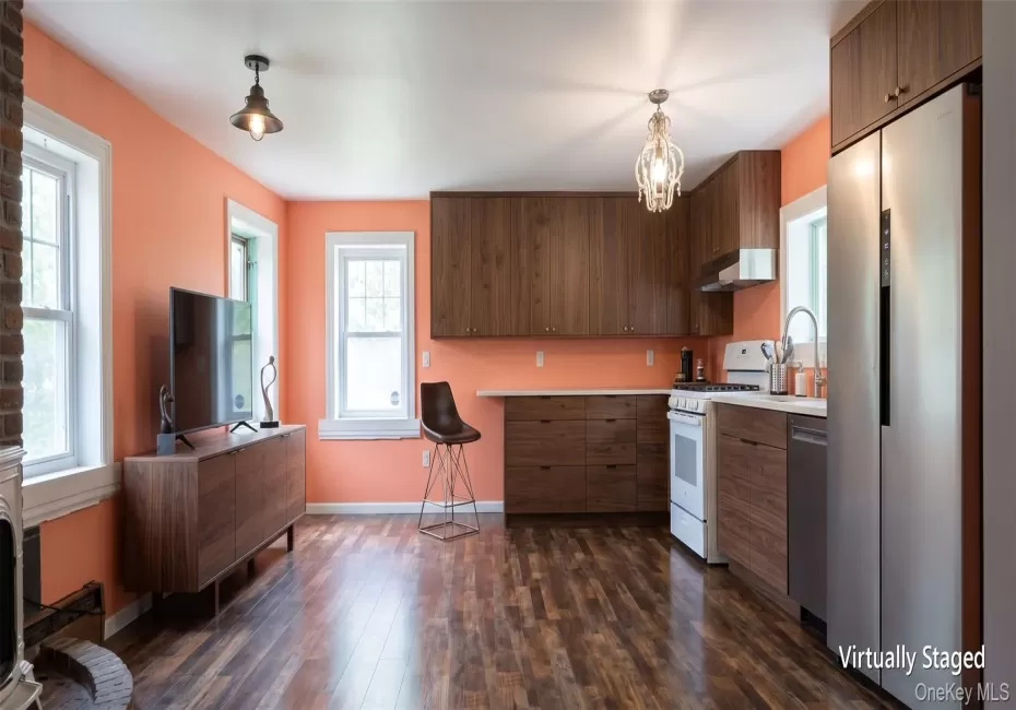 Open-concept living space w a full kitchen and a stainless steel side-by-side refrigerator, Virtually Staged Open-concept living space w a full kitchen and a stainless steel side-by-side refrigerator, Virtually Staged