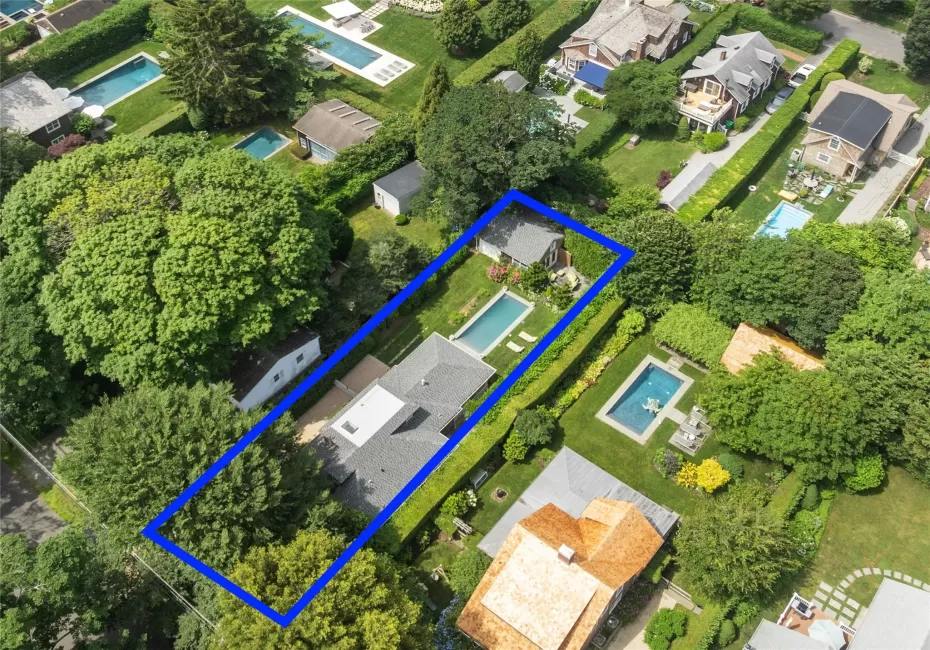 Aerial overview of property's location with nearby suburban area and property parcel outlined Aerial overview of property's location with nearby suburban area and property parcel outlined